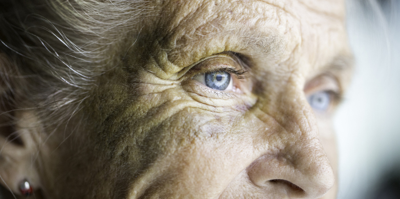 Old woman with coloured eye