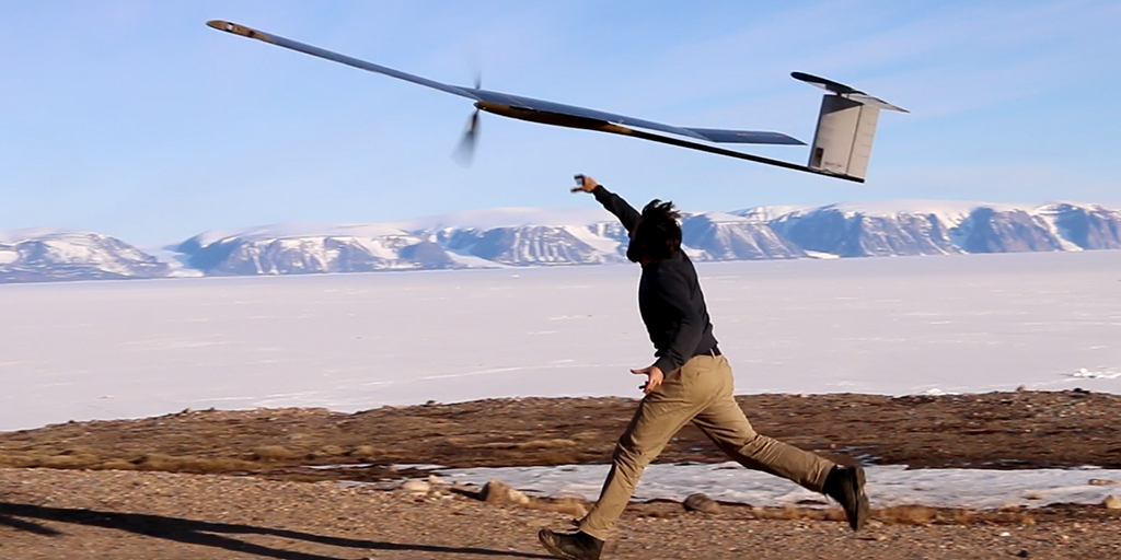 Man throws a drone into the air. 