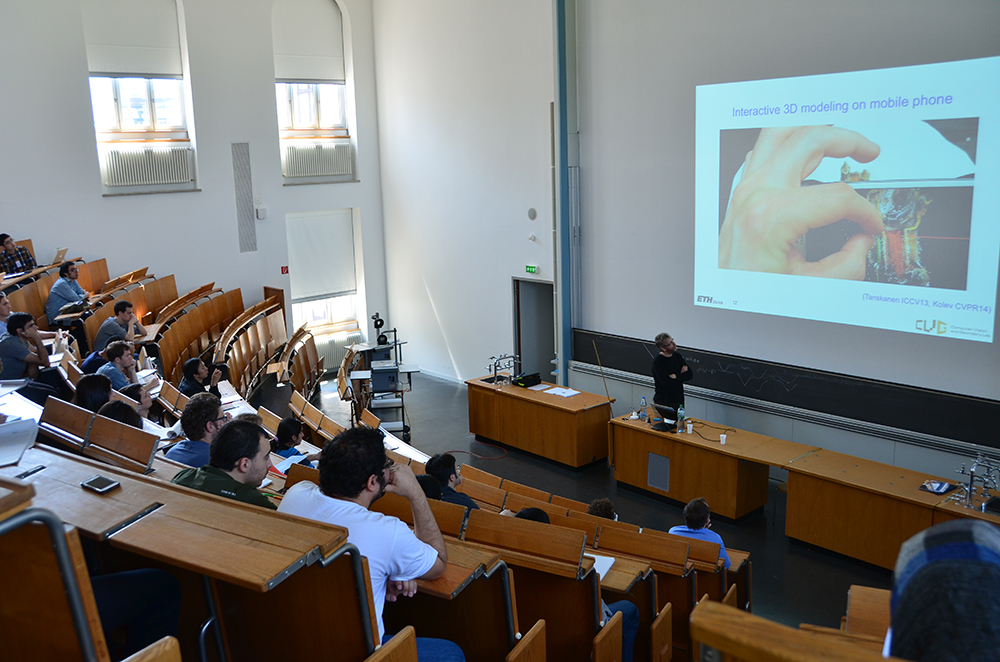 Enlarged view: PhD students listening to presentations during the summer school at ETH