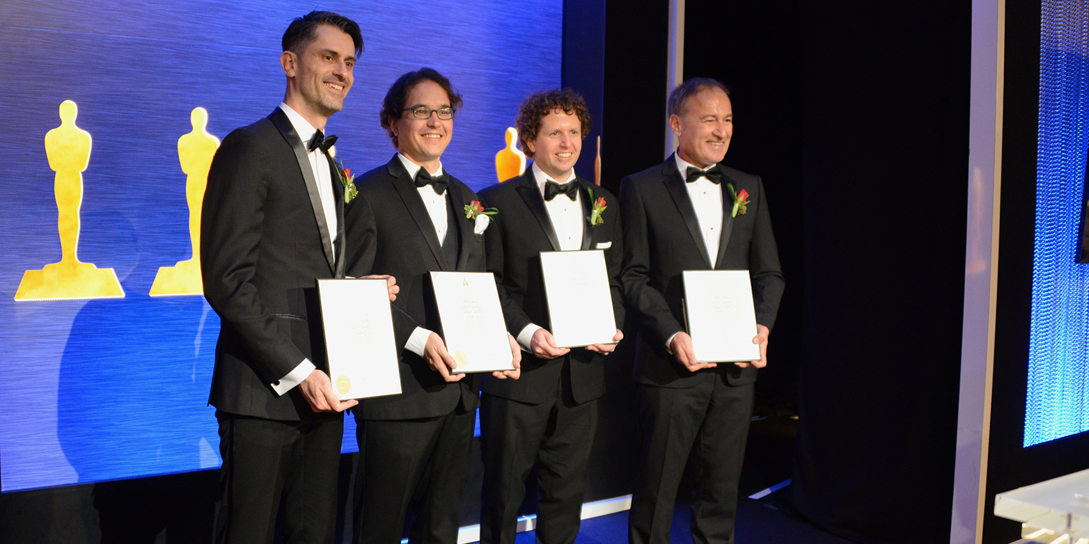 Enlarged view: Bernd Bickel, Thabo Beeler, Derek Bradley and Markus Gross (from left) are presenting their award certificate to the press. (Photo: Cyrill Beeler / ETH Zürich)