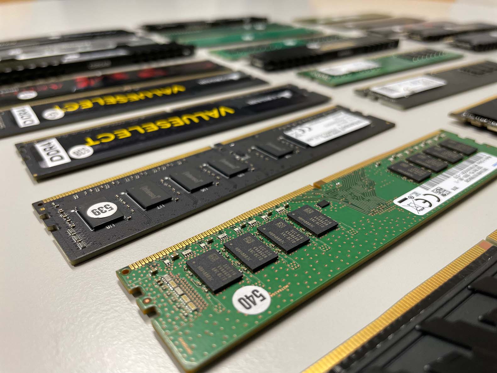 DRAM memory modules laying on a table next to each other