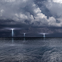 Storm weather with lightning over the ocean