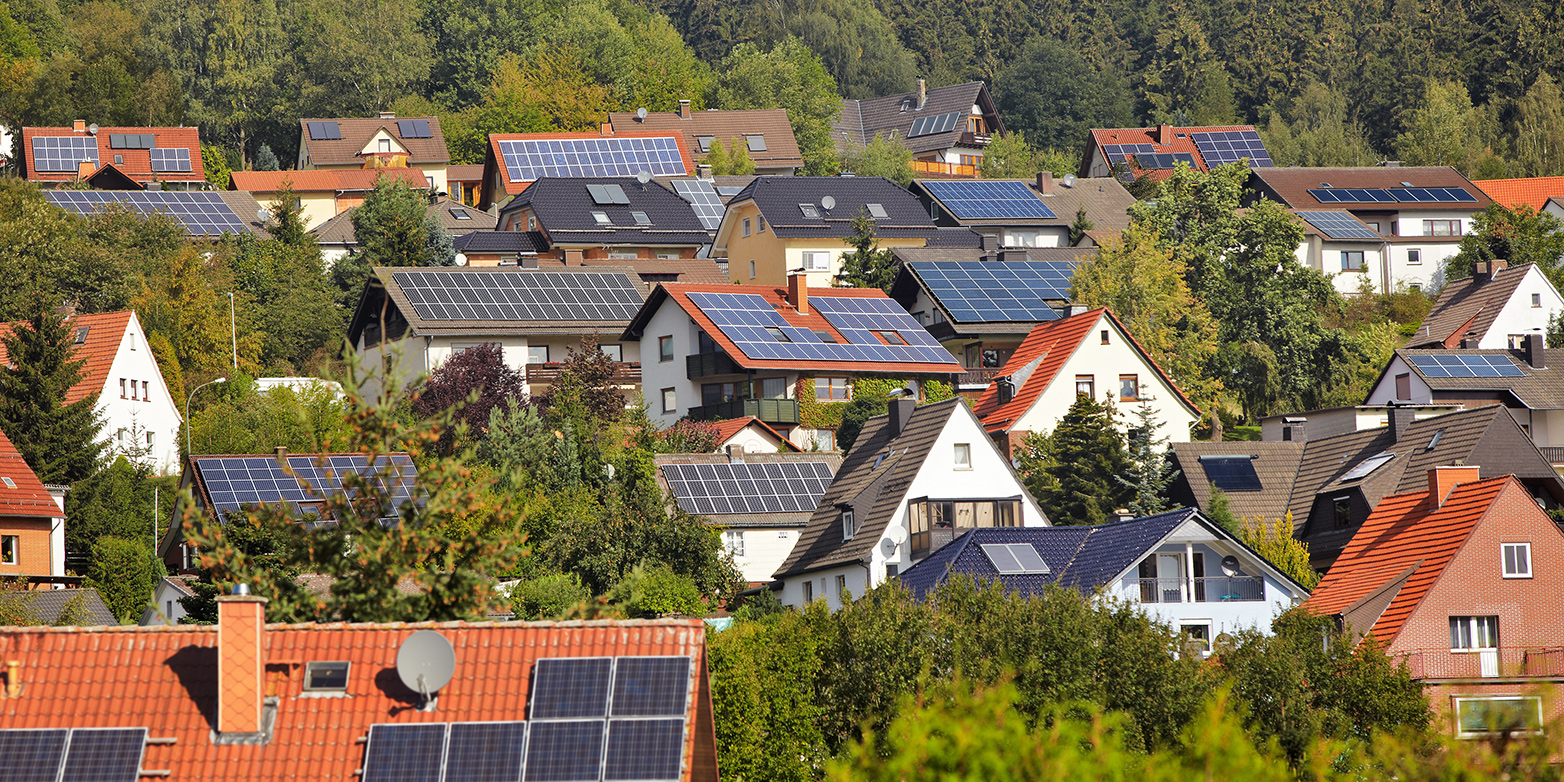 Houses with solar panels on the roofs