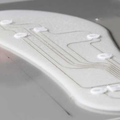 White insole with integrated sensors during sealing.