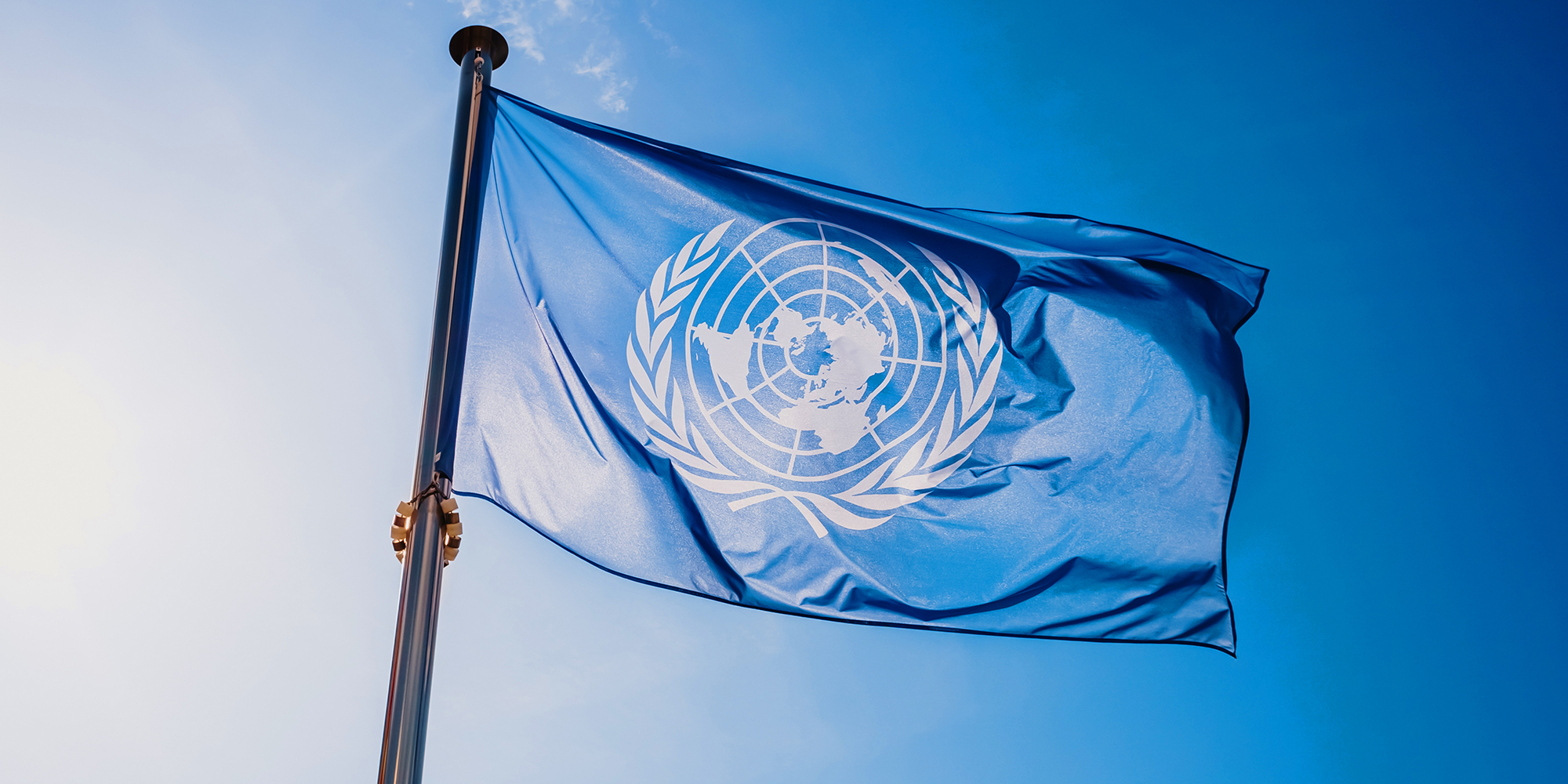Flag of UN against blue sky