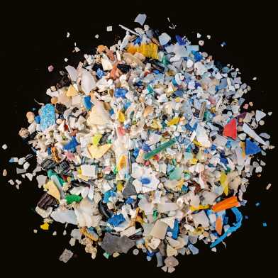 A pile of microplastic from above against black background
