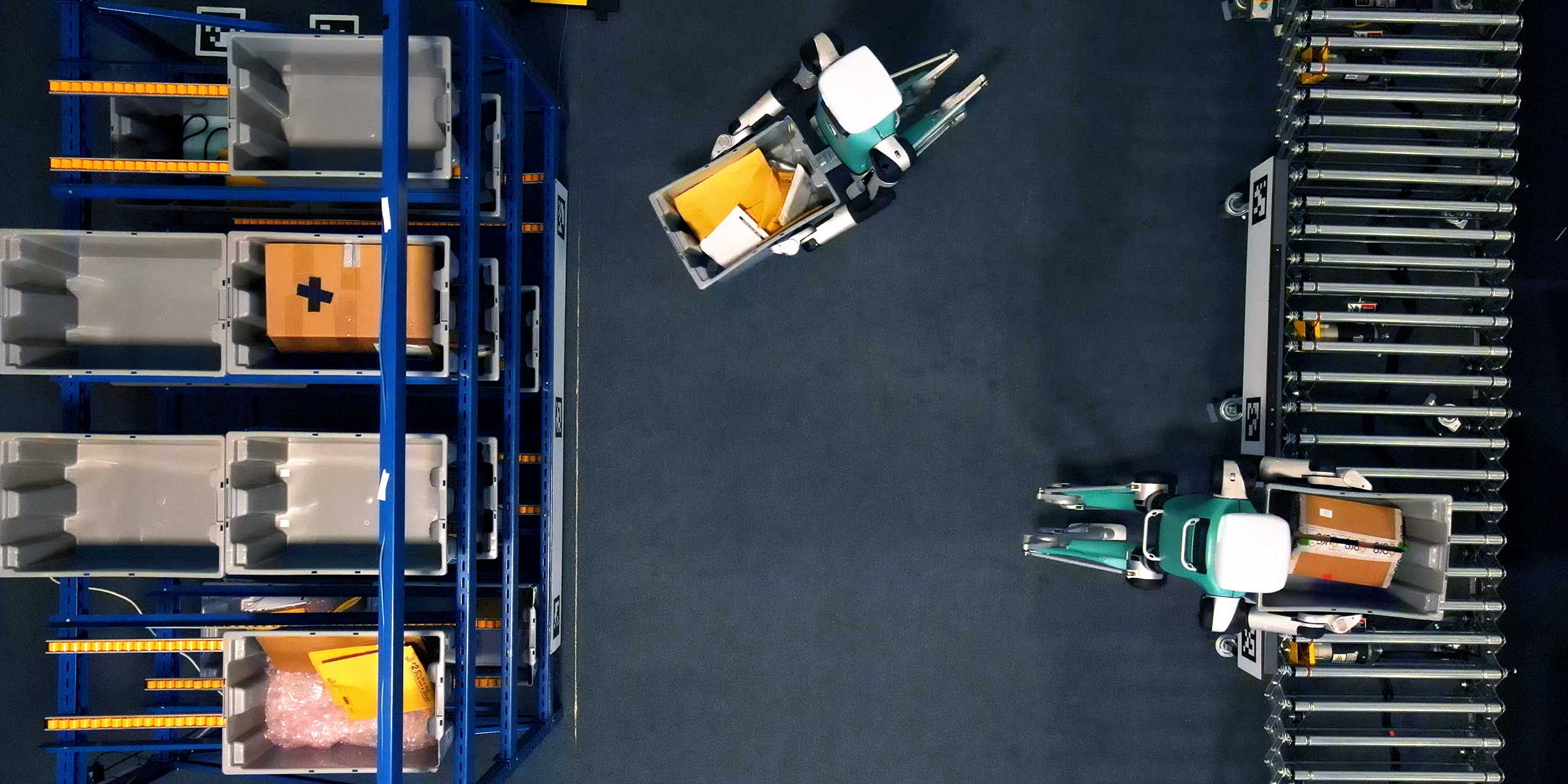 A bird's eye view of two Digit robots stocking shelves