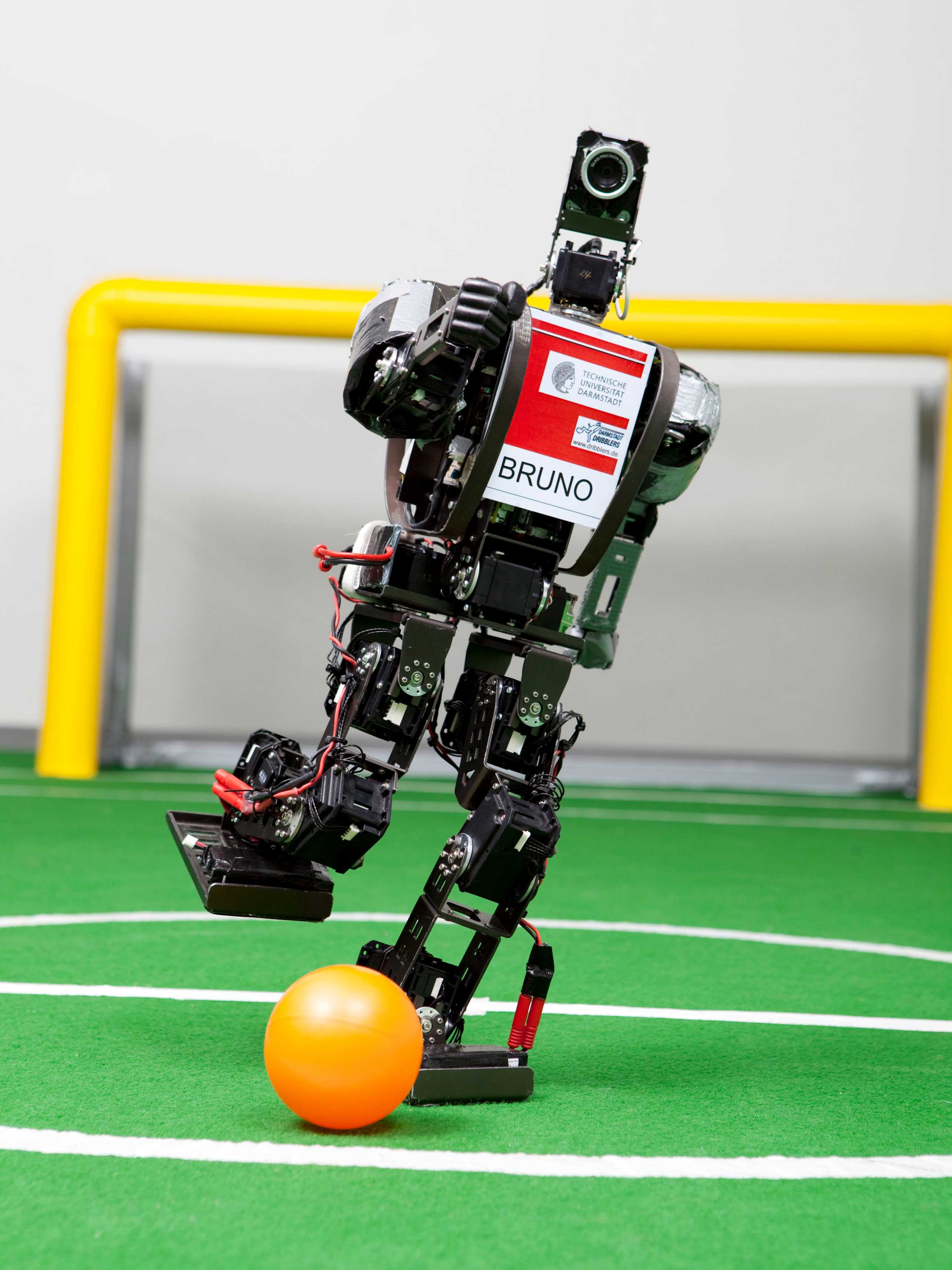 A robot in motion while playing soccer